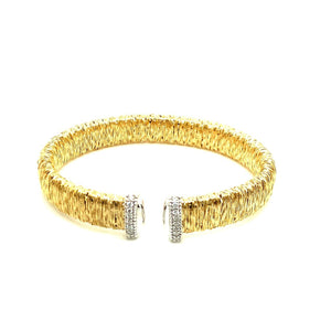 Gold wrapped bracelet with white gold diamond ends - Kelly Wade Jewelers Store